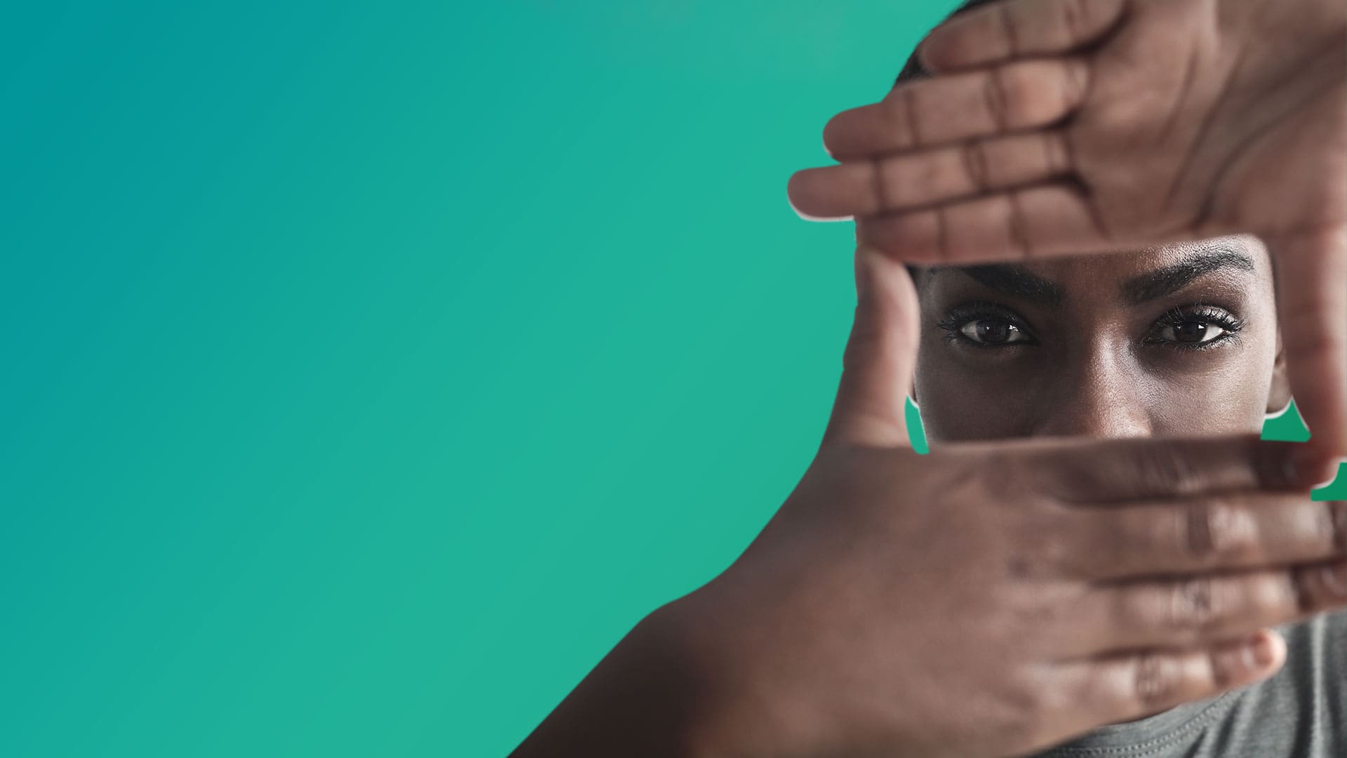 Image of a black woman looking through a rectangle created with her hands